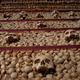 Illustration for article titled These Buildings Are Made with Skulls and Bones